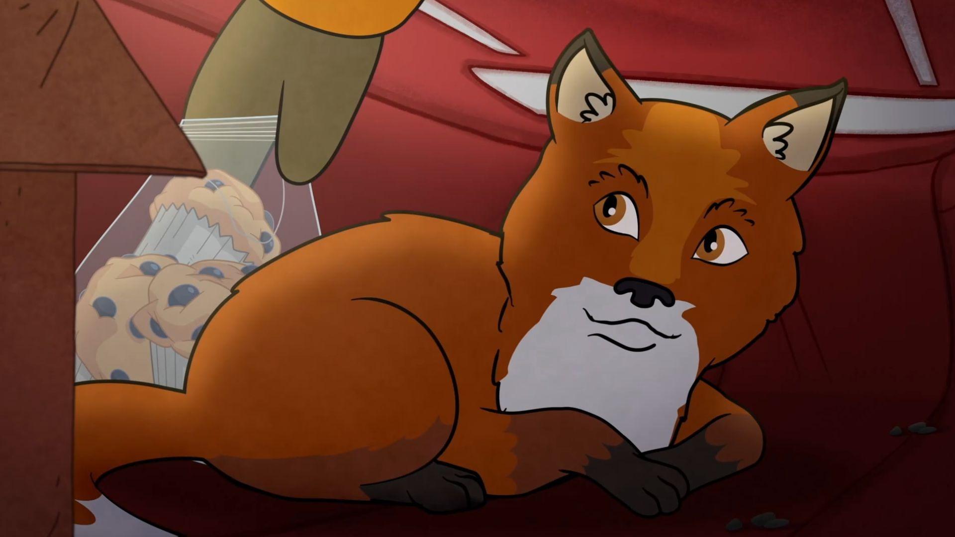 Molly warms her feet in the sled bag, but there's something fuzzy in it? It's a baby fox!