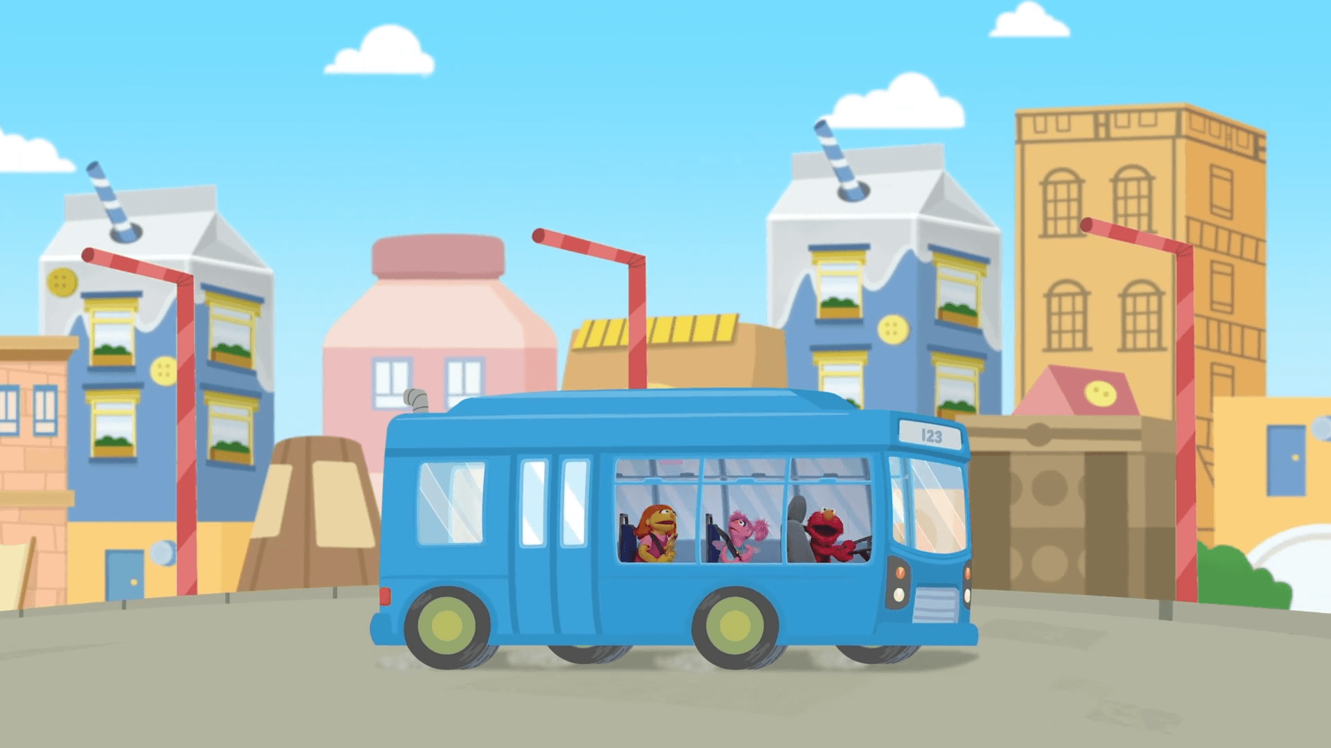 Elmo helps Abby and Julia rebuild their mini city.
