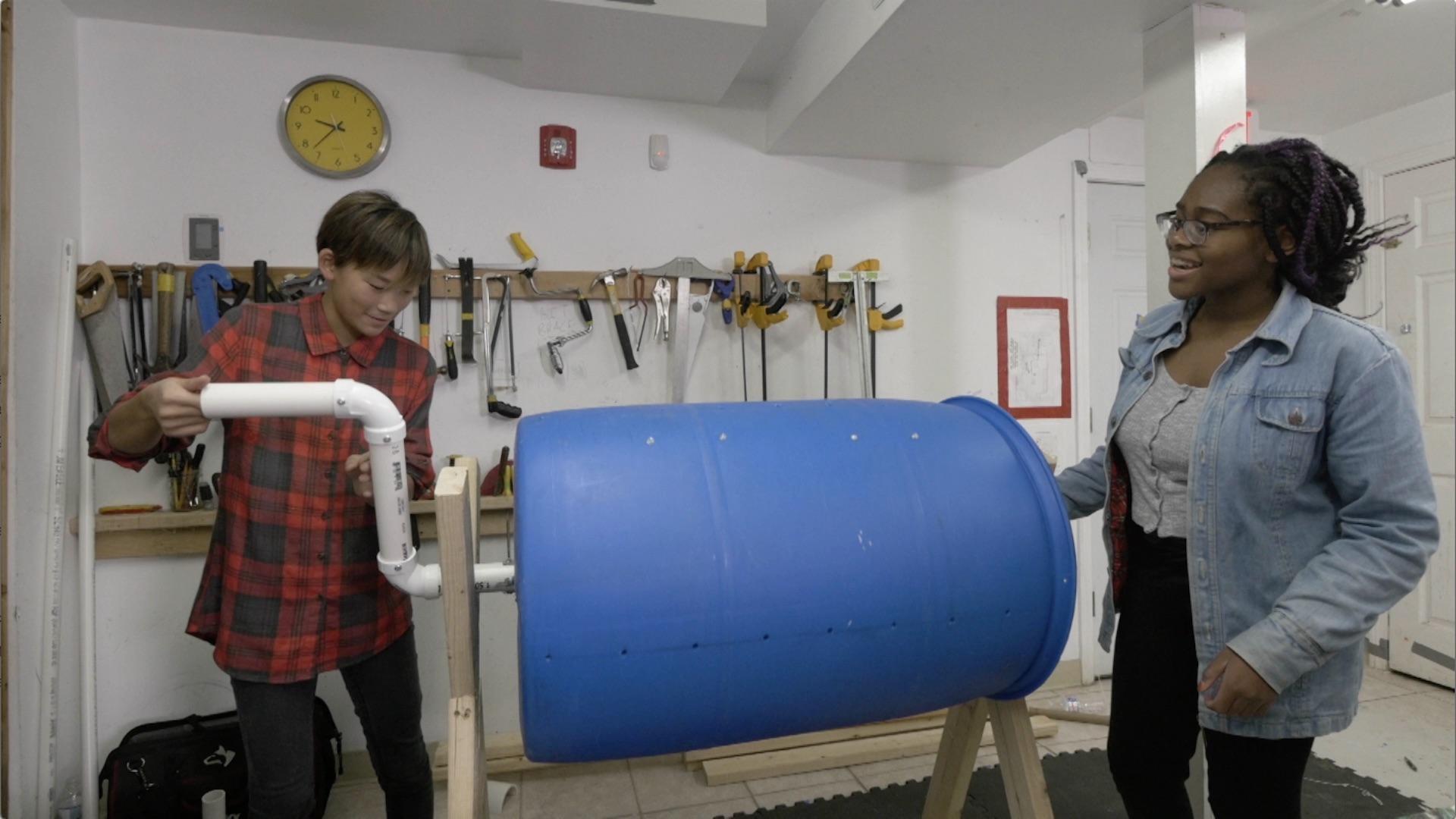 See how kid engineers Zuzu and Kyra make a compost tumbler to turn scraps into plant food!