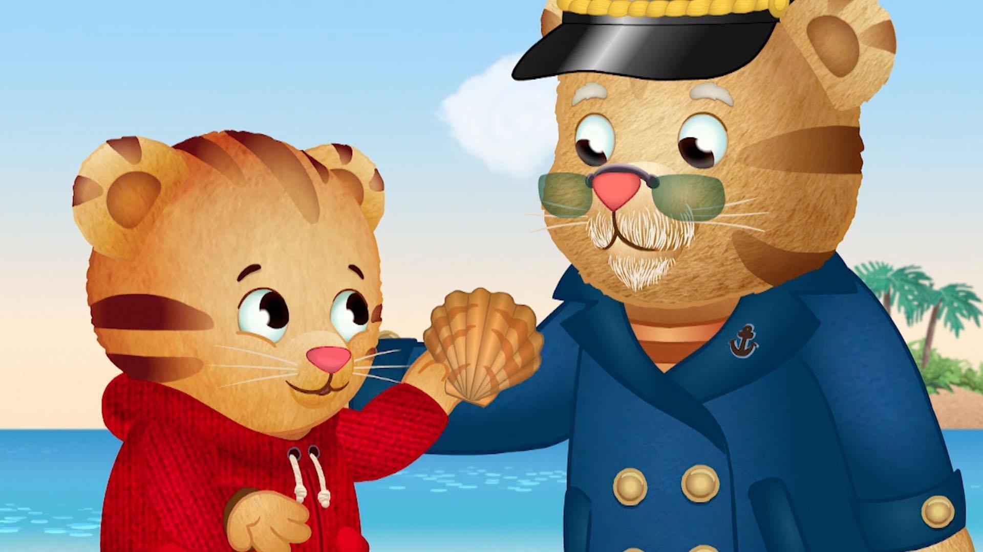 The tide is too low to take a boat ride, so Grandpere and Daniel play on the beach.