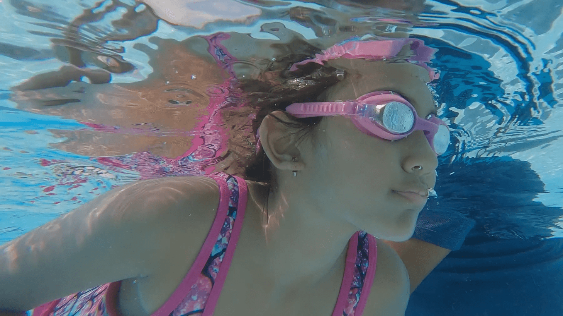 Meera goes swimming with her dad and she even swims to the end of the pool all by herself!