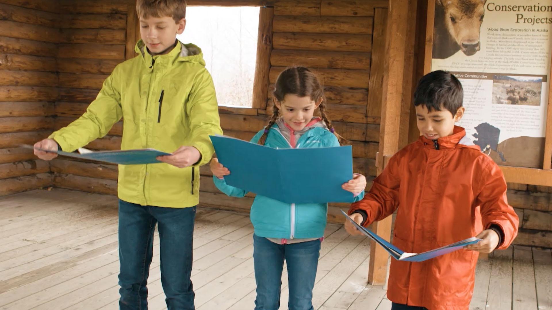 At a wildlife sanctuary in Anchorage, kids search for an umingmaq using text clues.