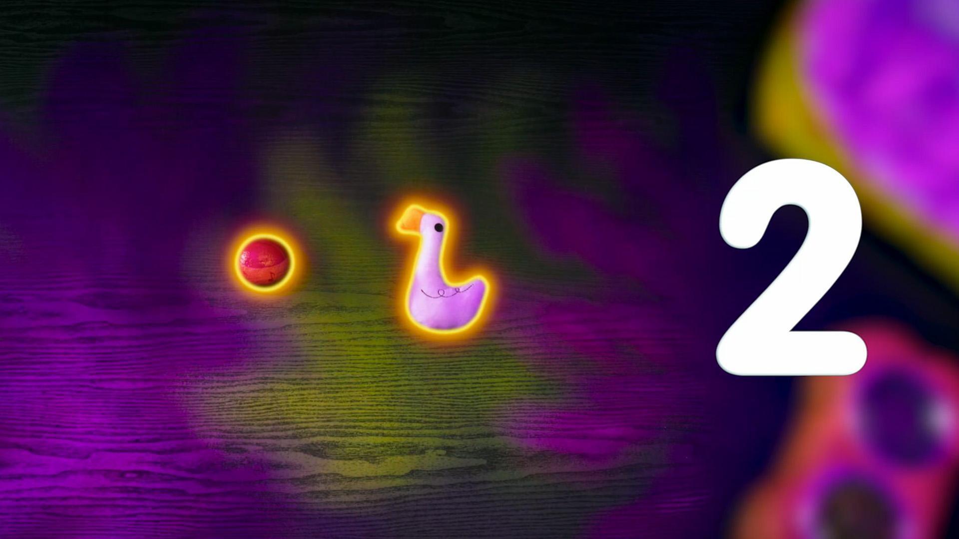 Elmo and Tango count the number of dog toys for the number of the day.