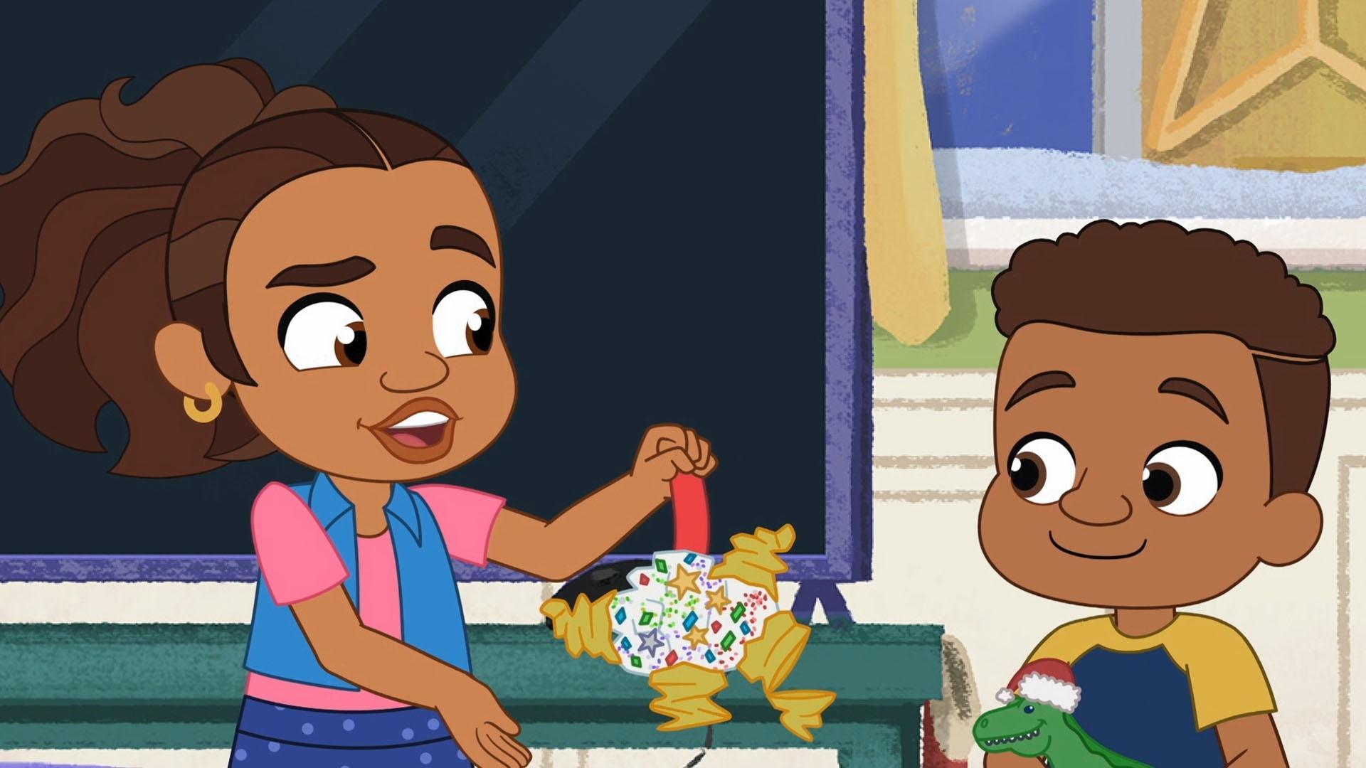 Alma and Junior make an ornament. It comes out wonky, but they still put it on the tree.