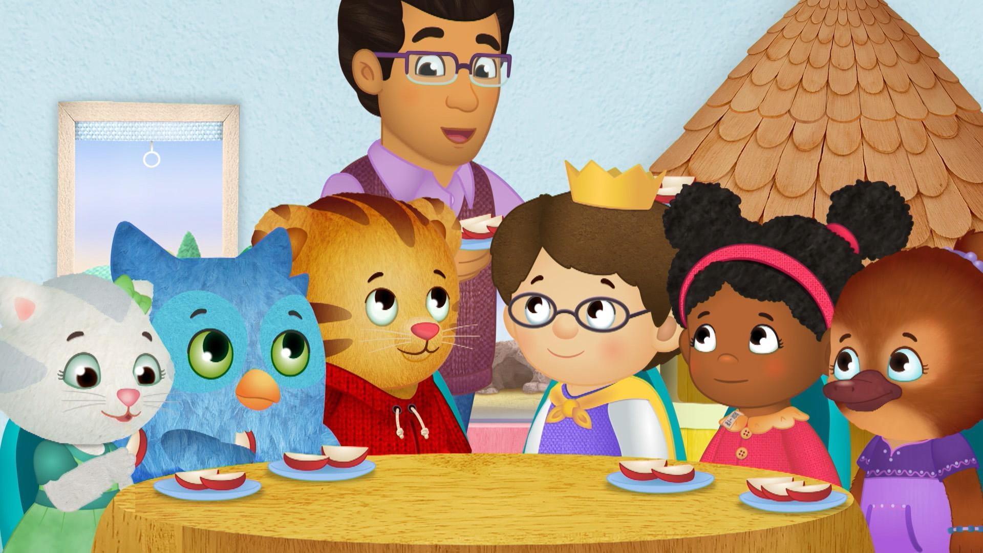 Daniel and Prince Wednesday stop looking at a book because it's time for snack.