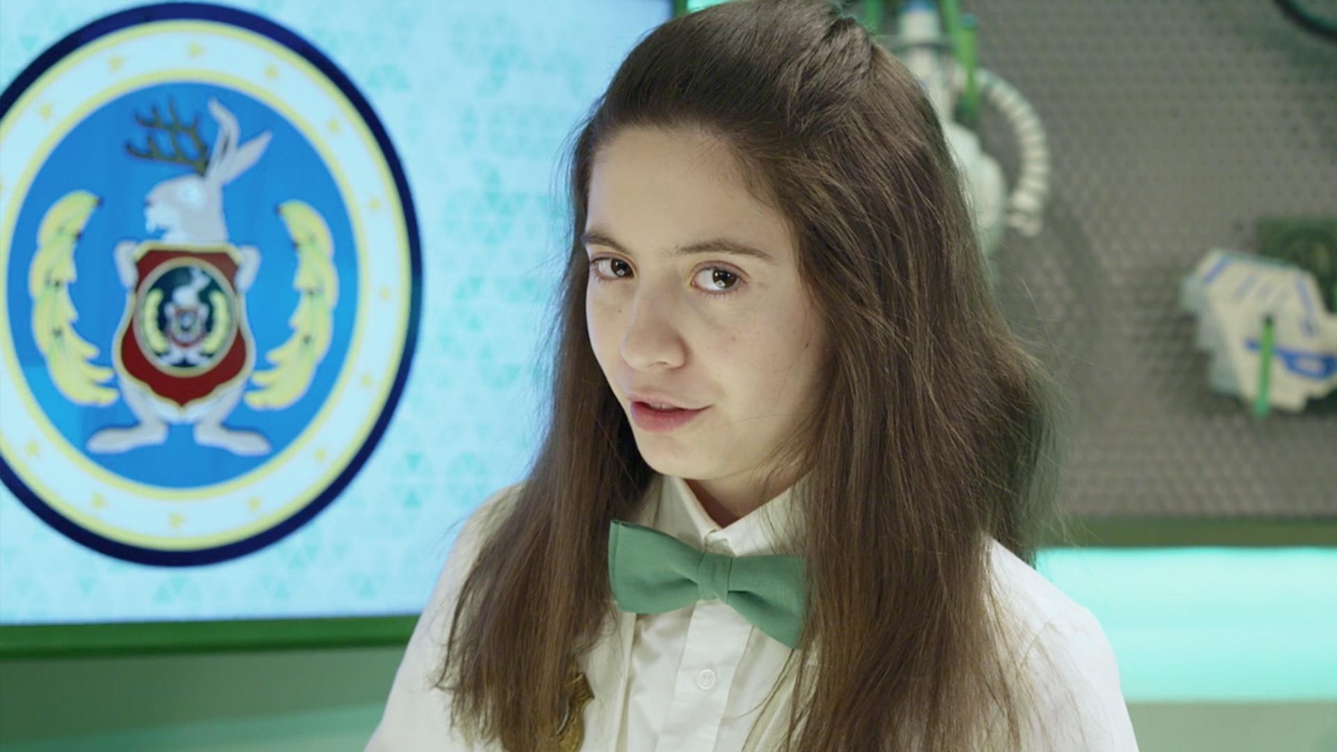 Agent Oona shows off some secret compartments in her lab.