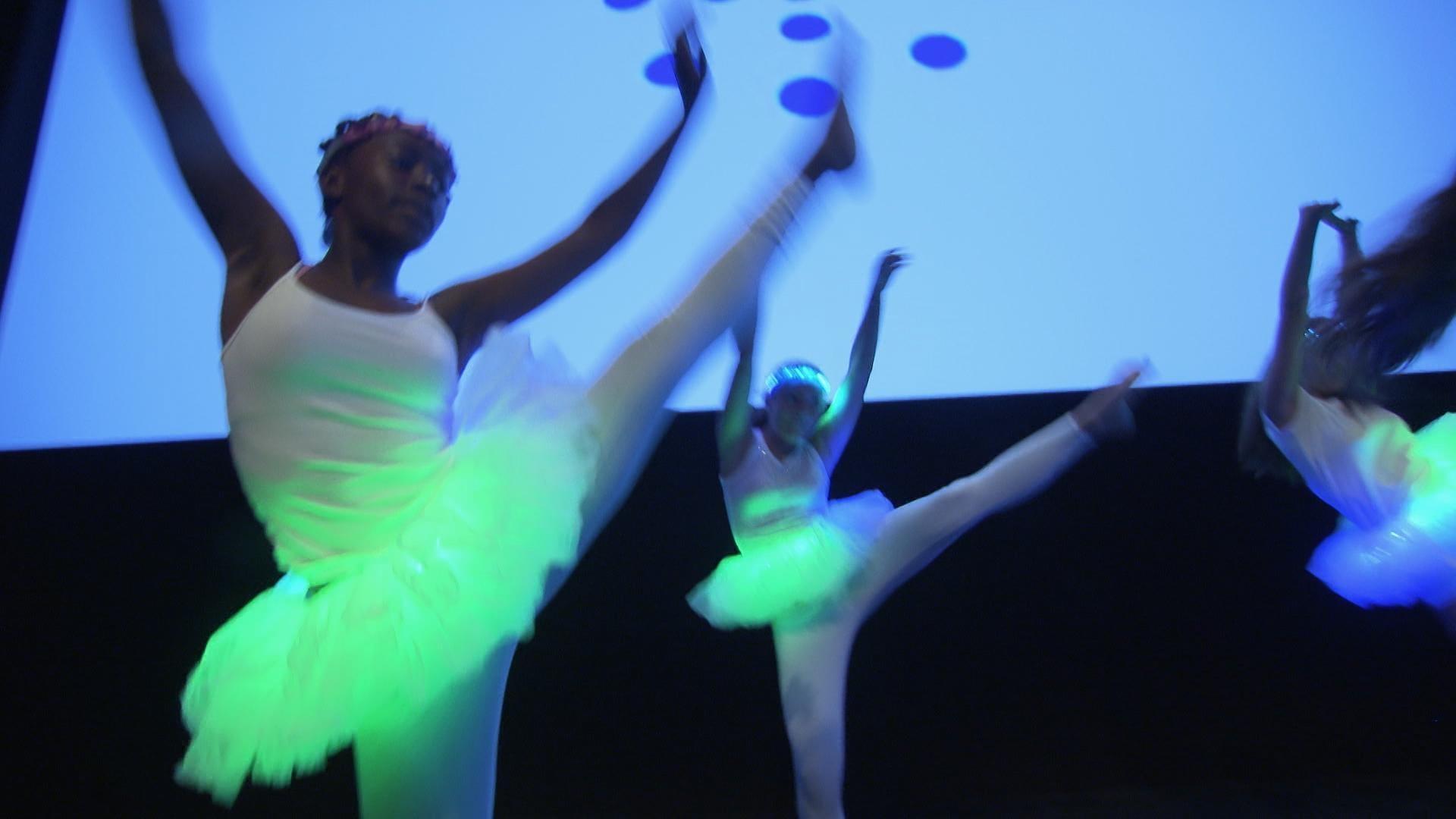 The SciGirls present their dance incorporating technology to their families and community.