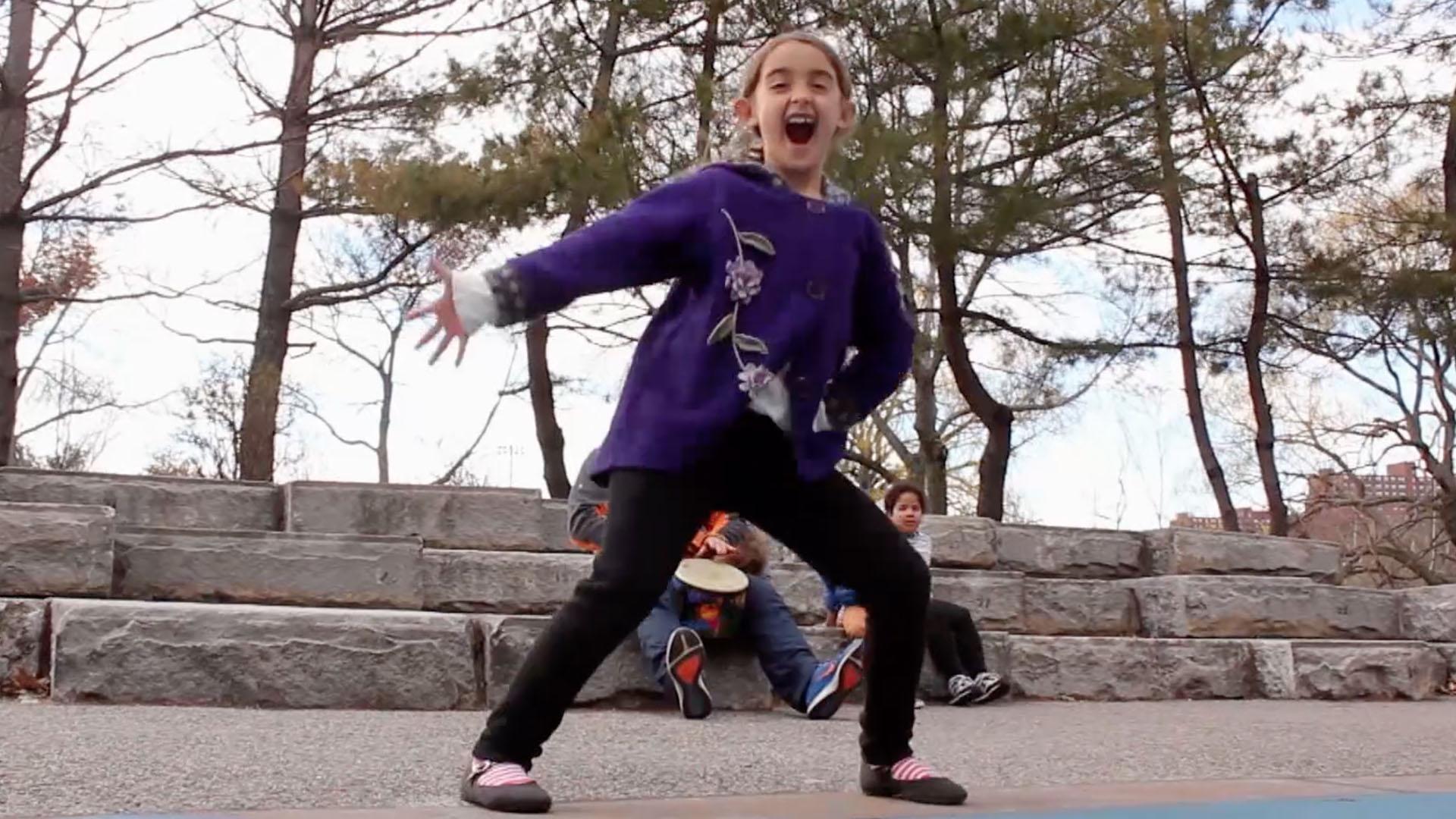 Some real friends make up dances at the park.