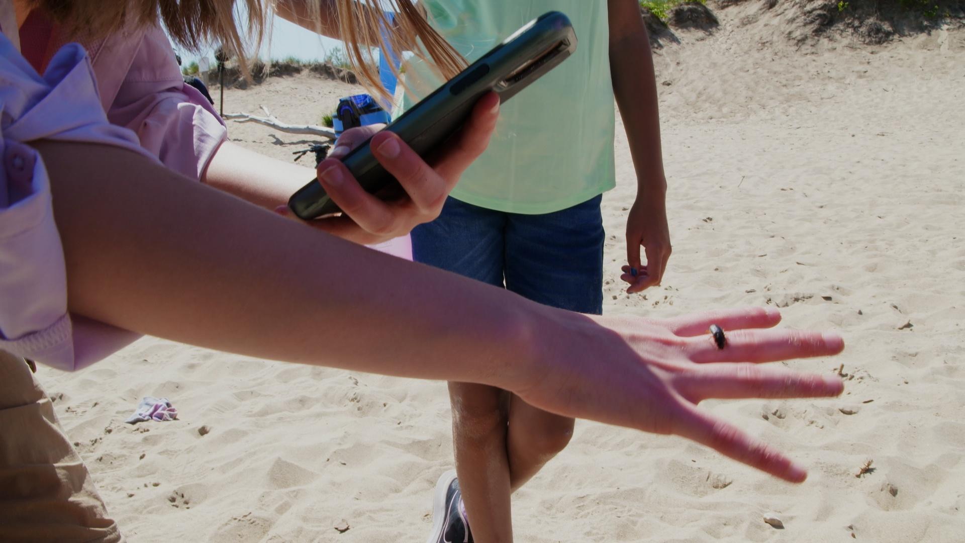 The girls learn from Luci's mom about a way to help scientists monitor water quality.