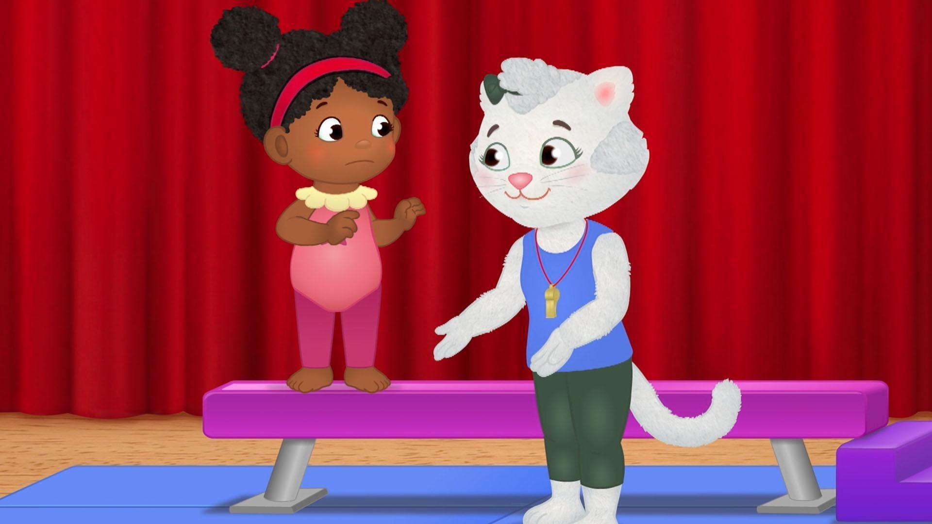 Daniel and his friends try the balance beam at gymnastics class.