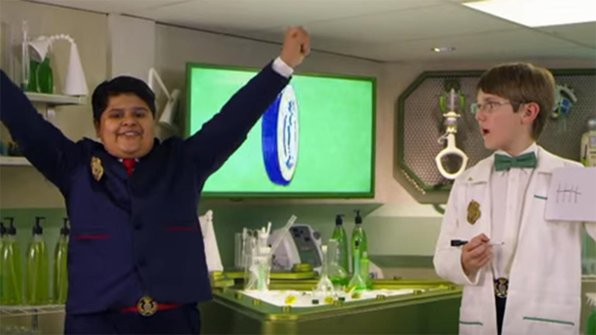 Oscar shows off the Odd Squad Lab
 and Olaf.