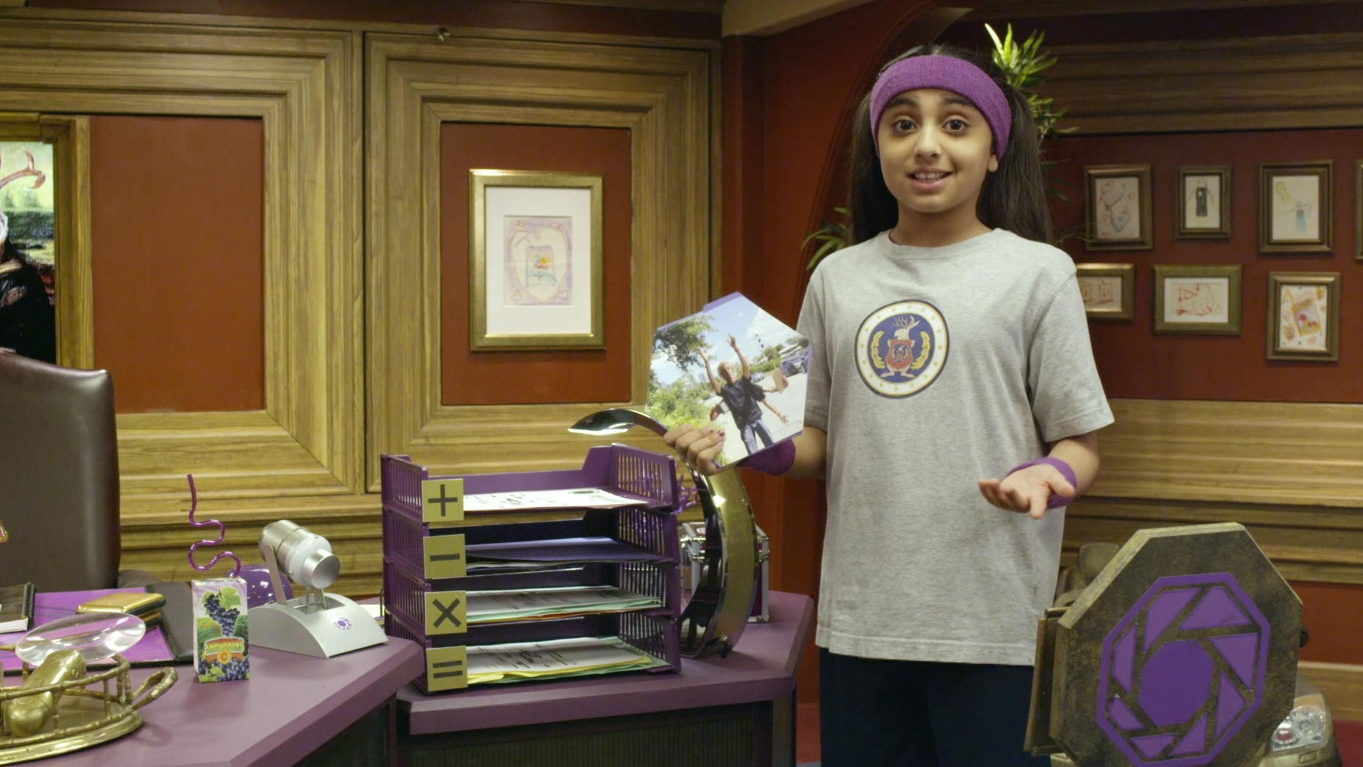 One of Ms. O's assistants gives a tour of Ms. O's office.