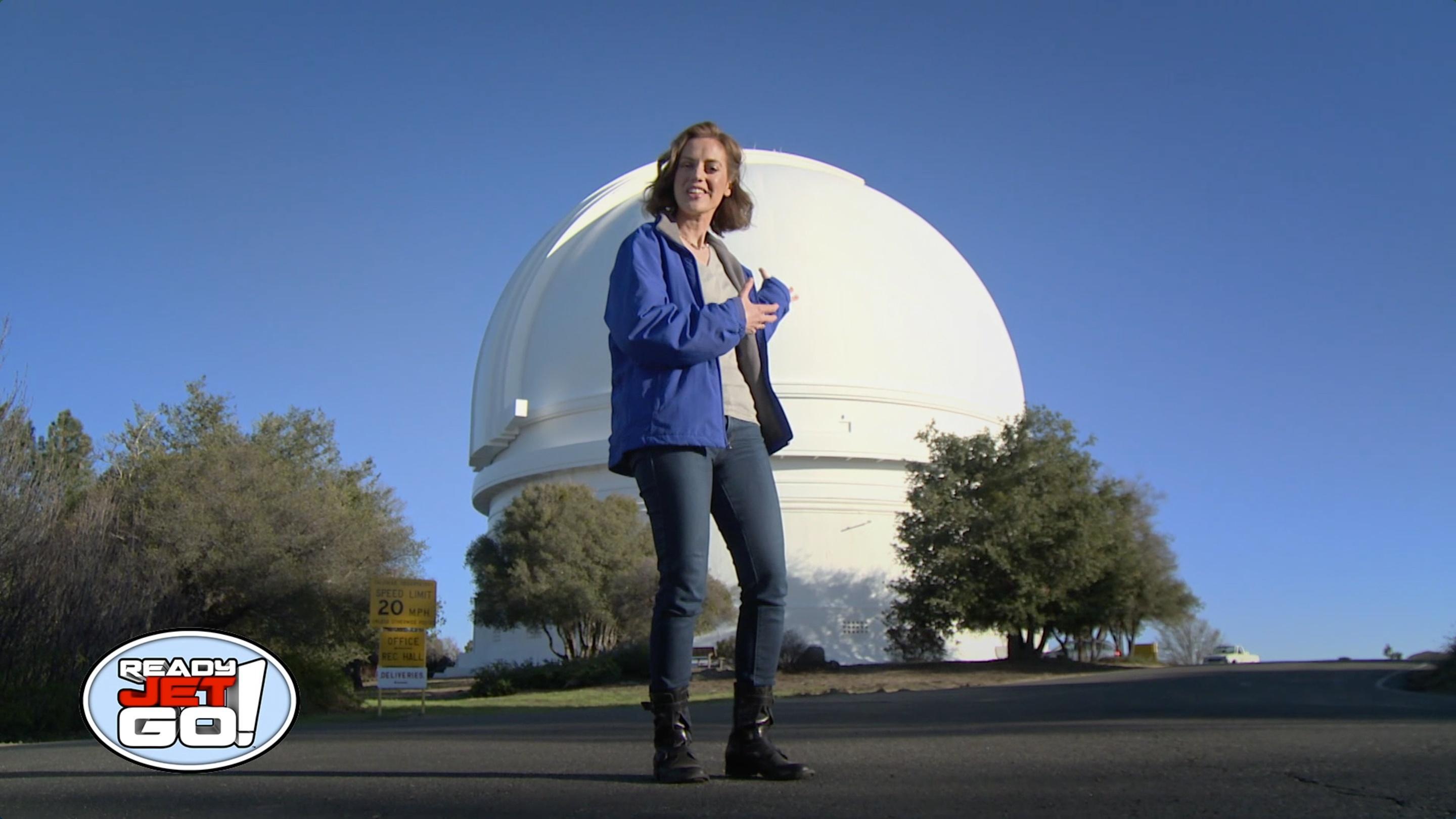 Astronomer Amy Mainzer meets with an astronomer at the Palomar Observatory.