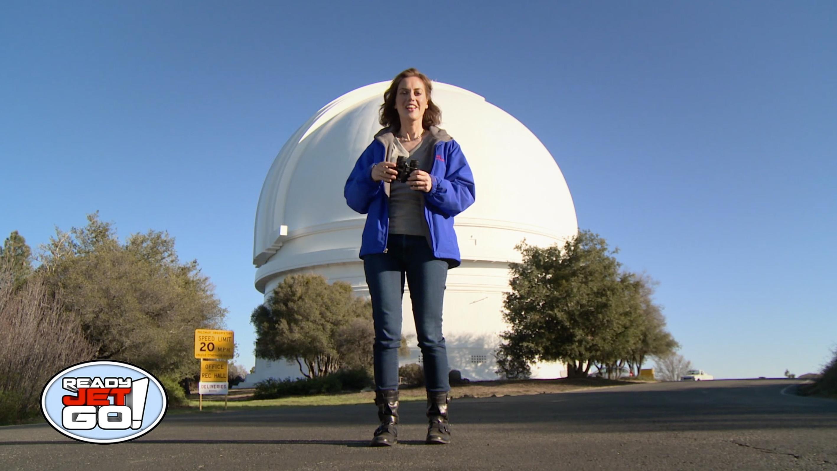 Astronomer Amy Mainzer explains how a pair of binoculars is similar to a telescope.