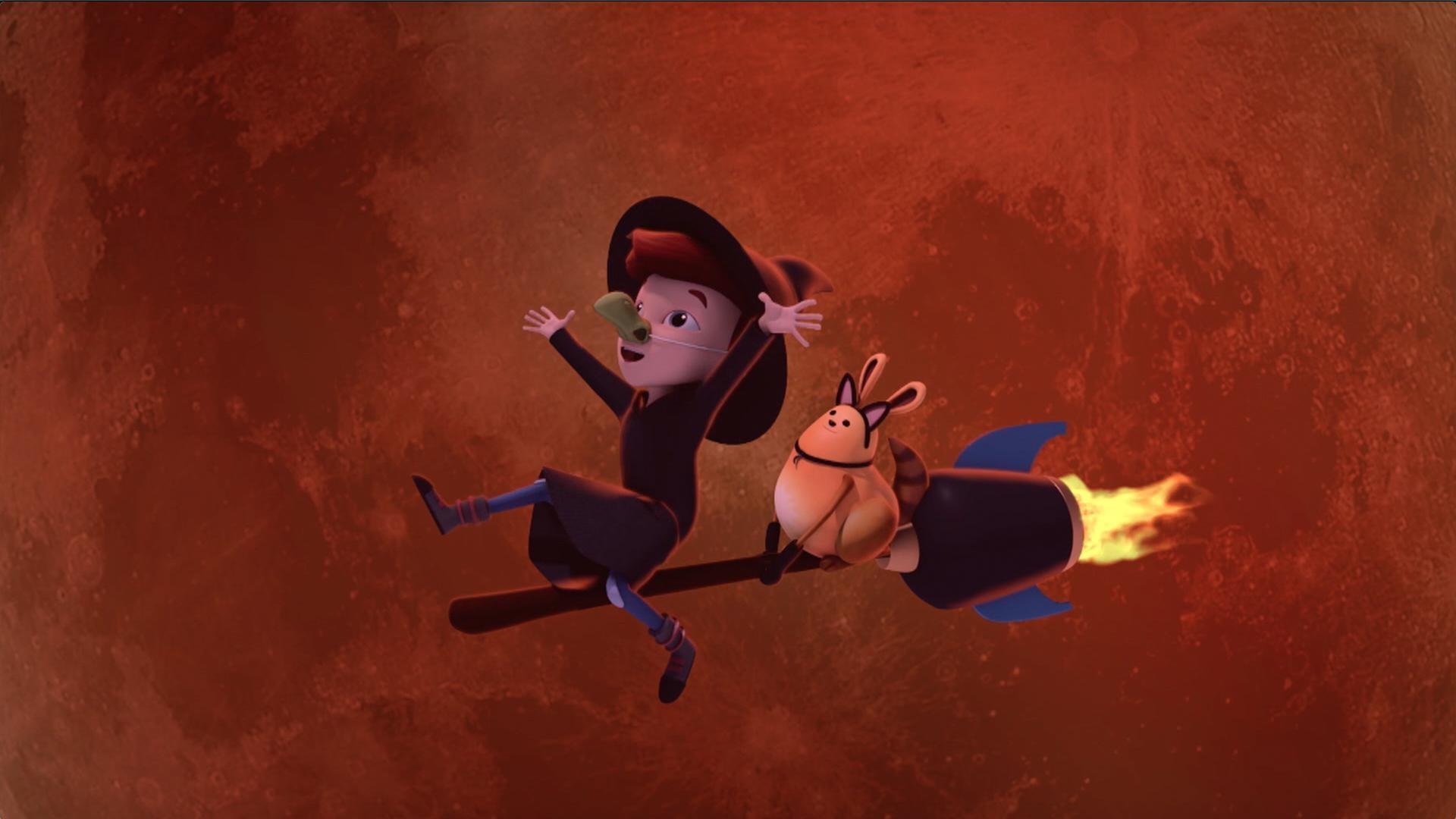 A witch flies across the full moon on Halloween night!