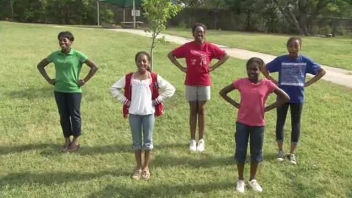 The SciGirls and their mentor present their investigation findings with spirit!