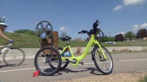 The SciGirls inspect an existing ice cream making bike.