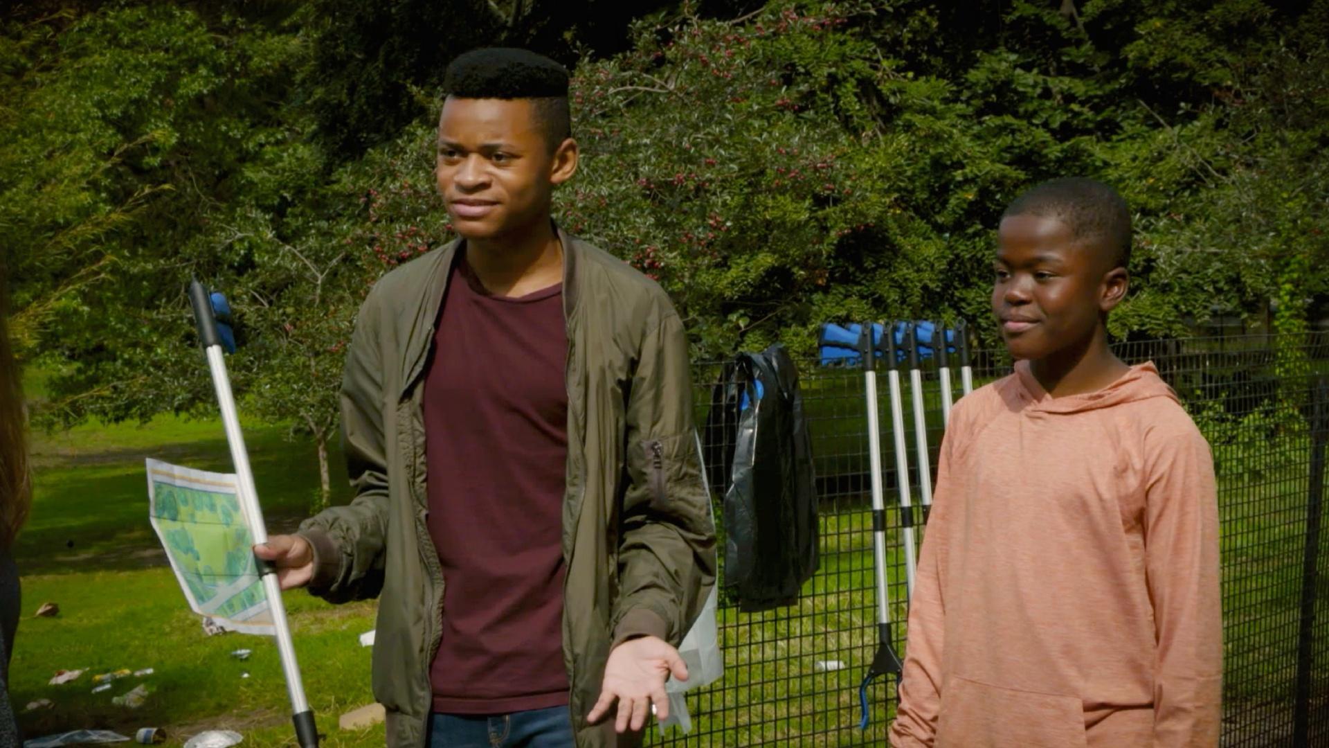 Booker and Jamal lead a trash clean-up campaign in their local park.