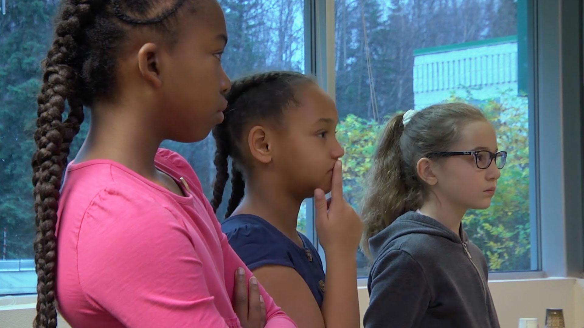 Real kids in Anchorage visit a bird rehabilitation center and learn what 'plumage' means.