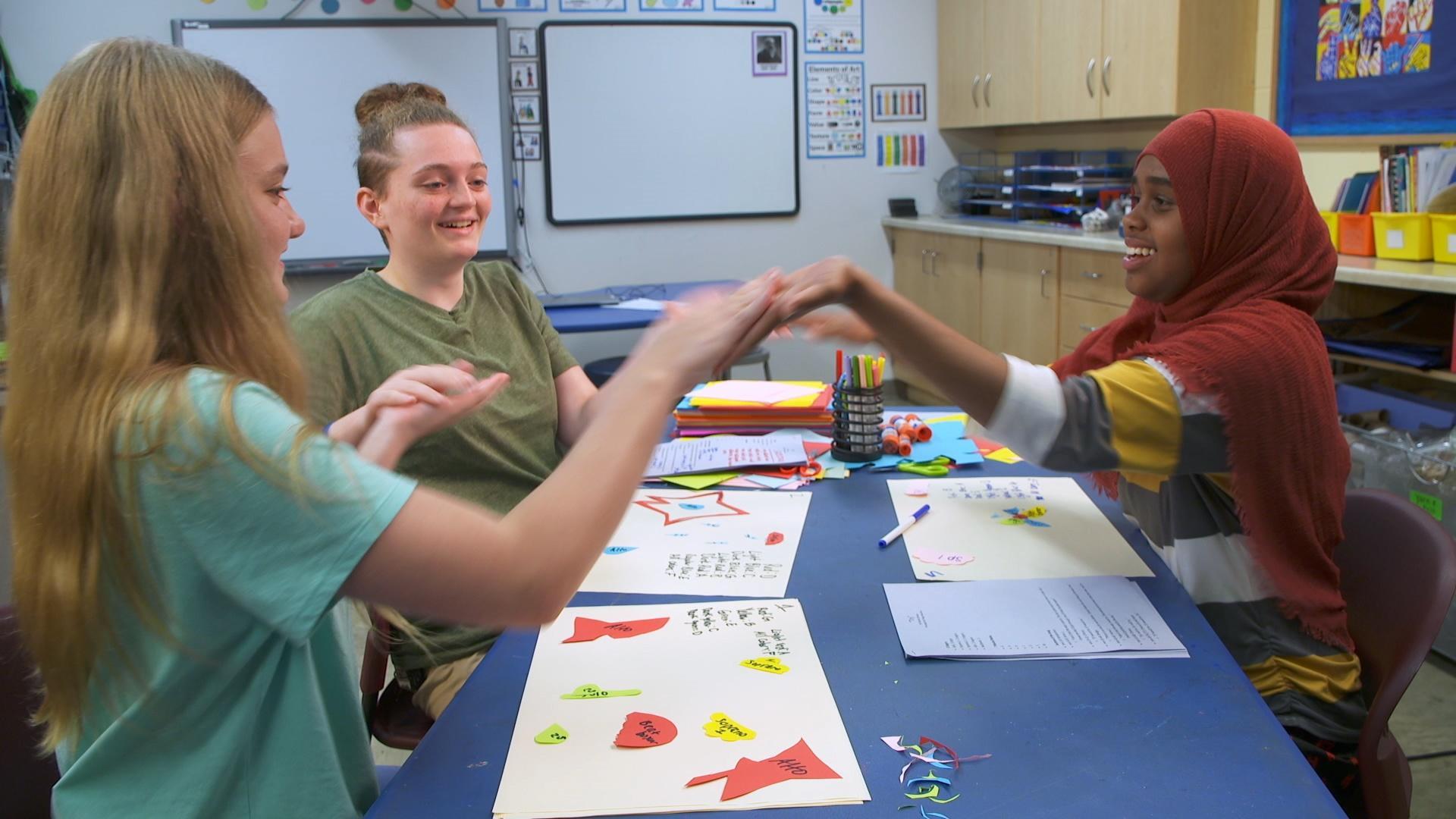 The SciGirls plot their visual interpretation of the song and start to plan their code.