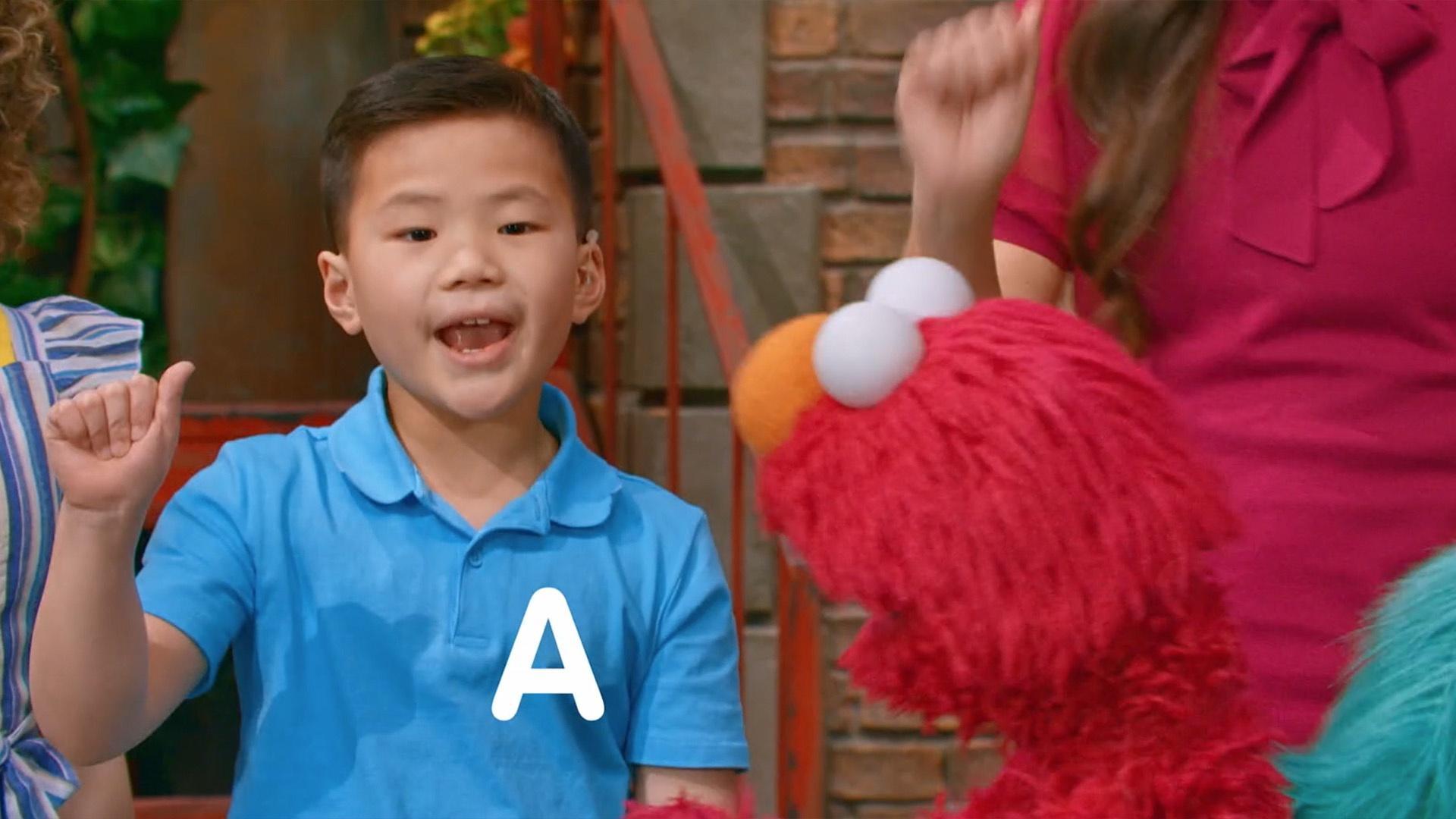 Elmo learns how to sign the Alphabet song using ASL!