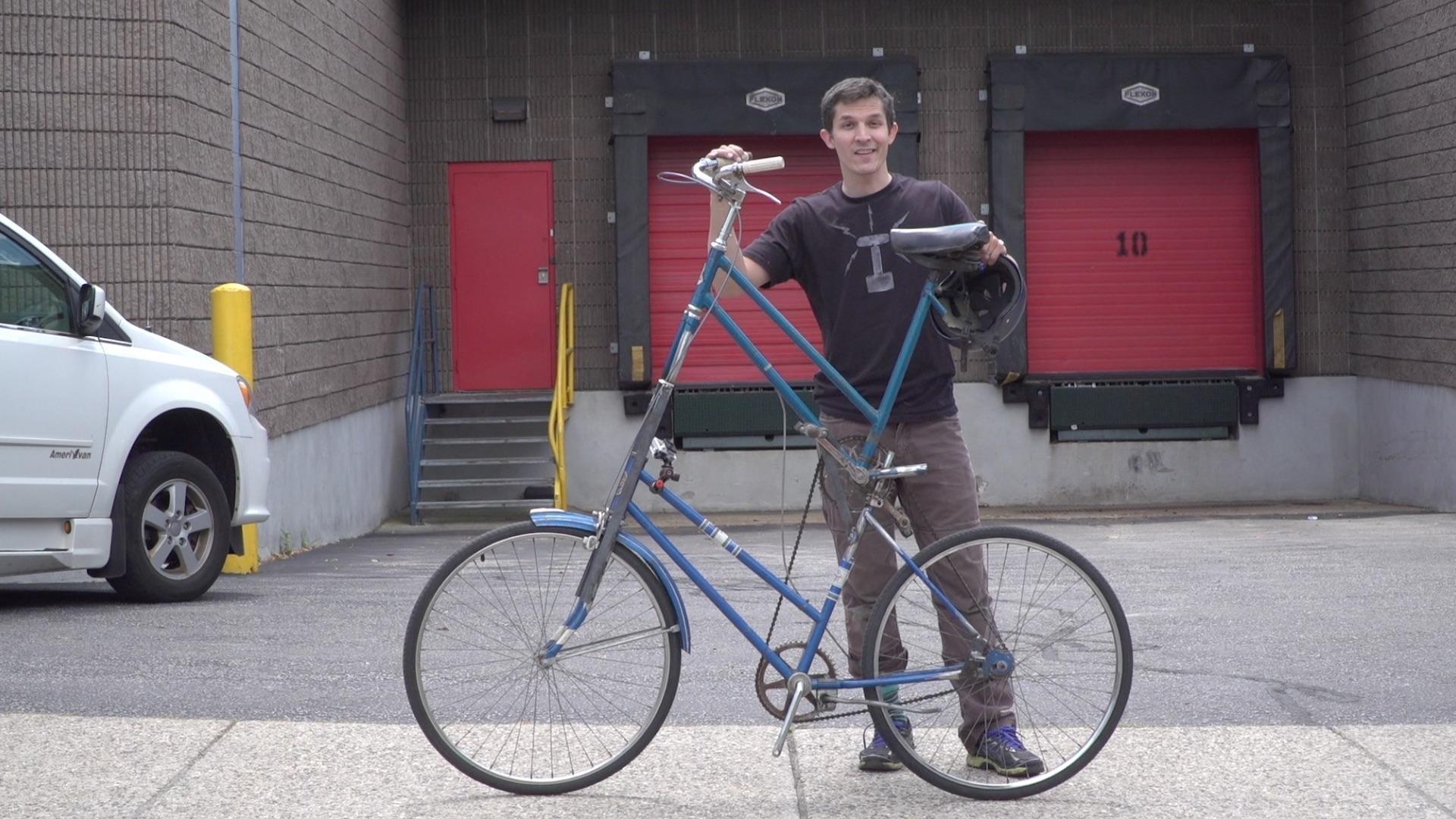 Nate builds and rides a tall bike to test if it is easy or hard to balance.