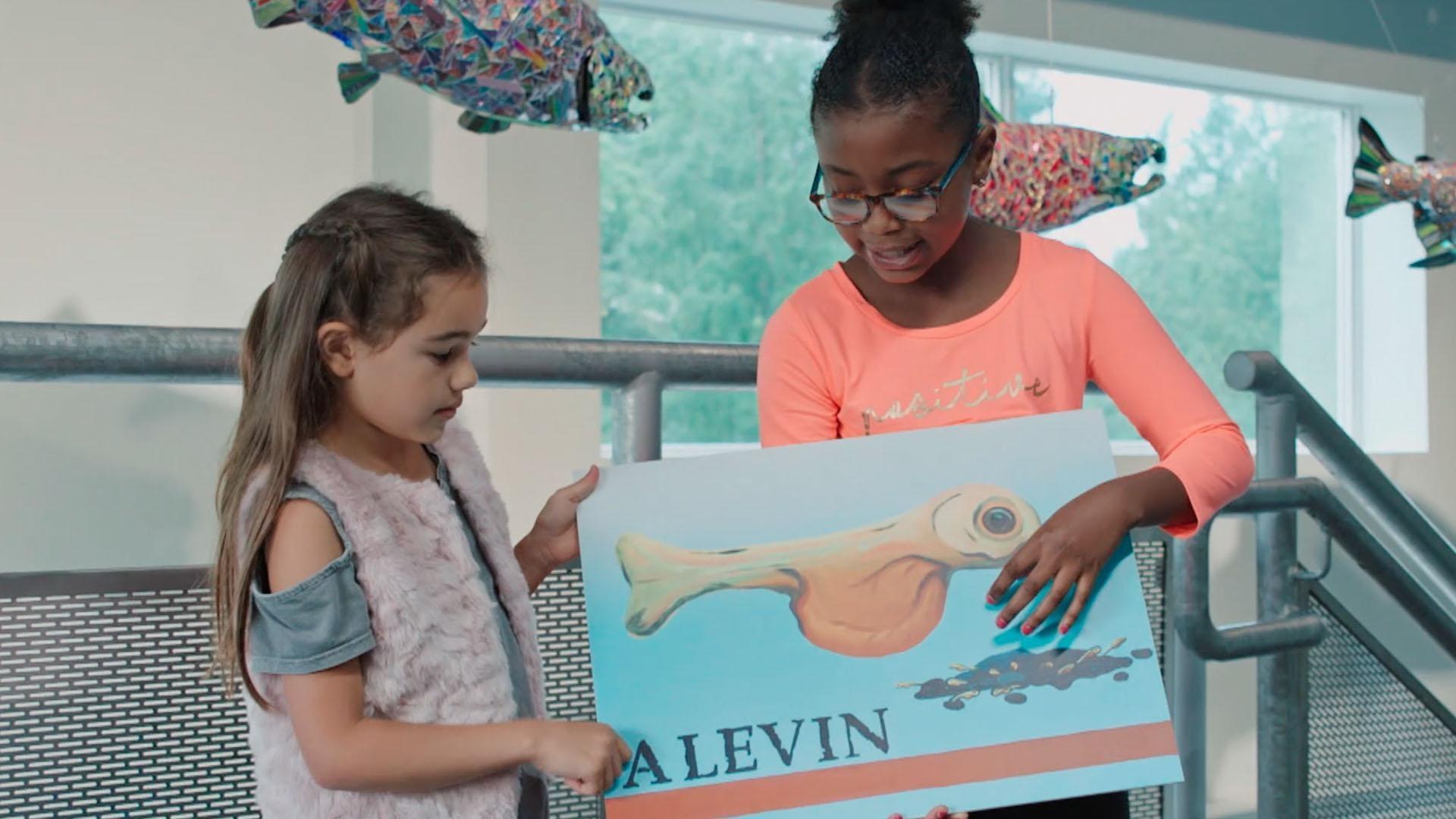 Kids in Anchorage, Alaska see the salmon lifecycle up close at a slamon hatchery.