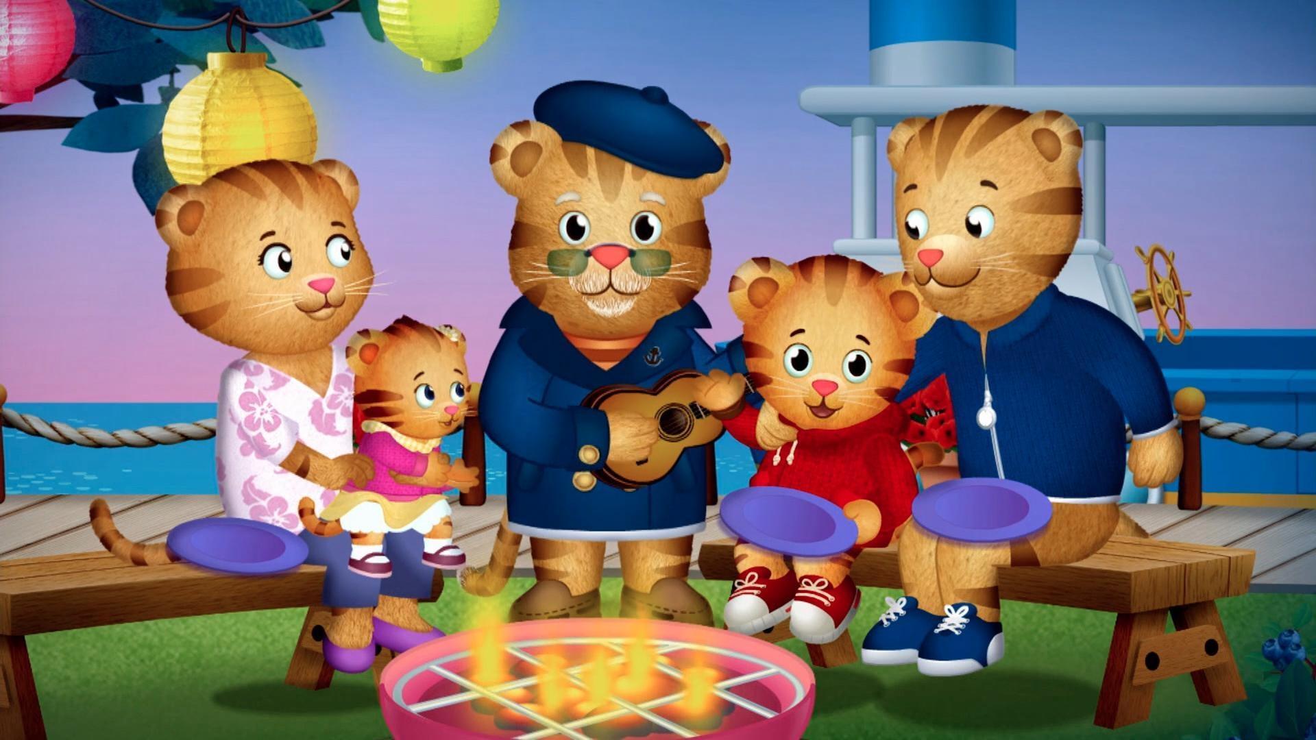 The Tiger Family celebrates being together with a song around the campfire.
