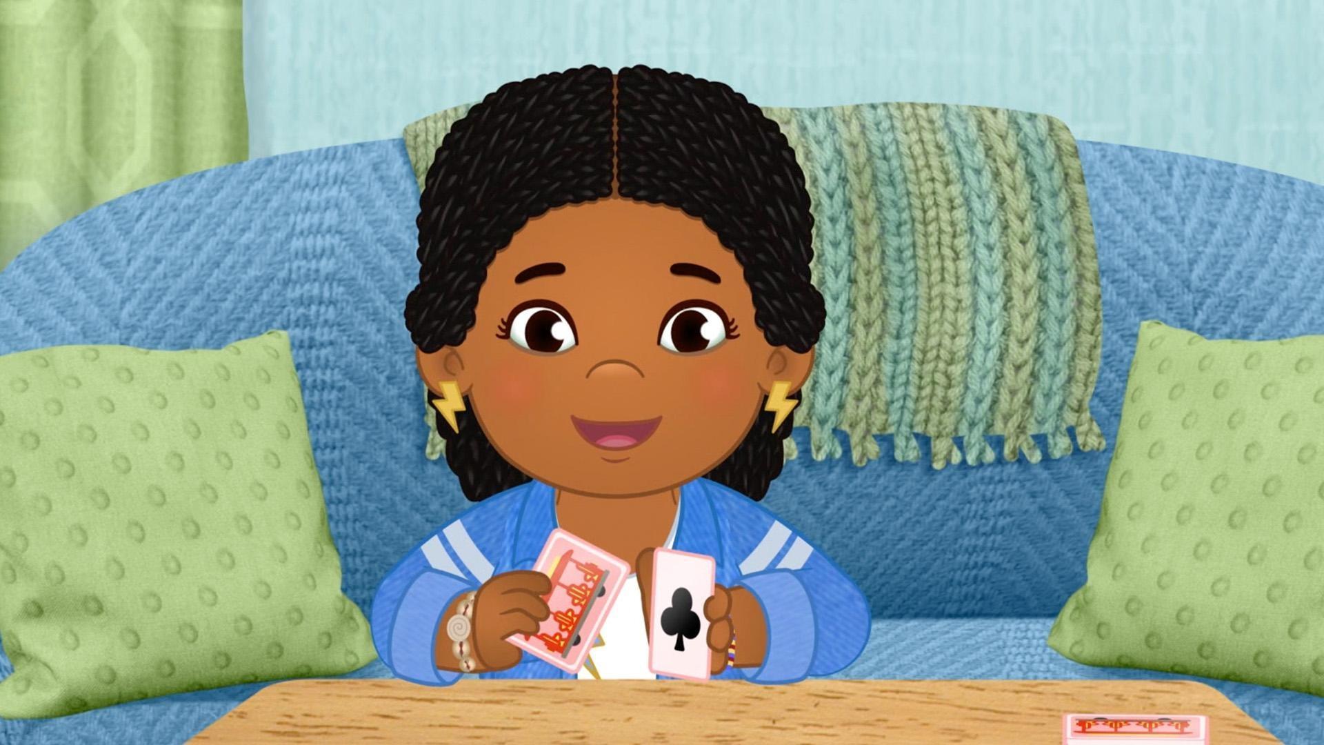 Amira shows us how to make a house with cards.