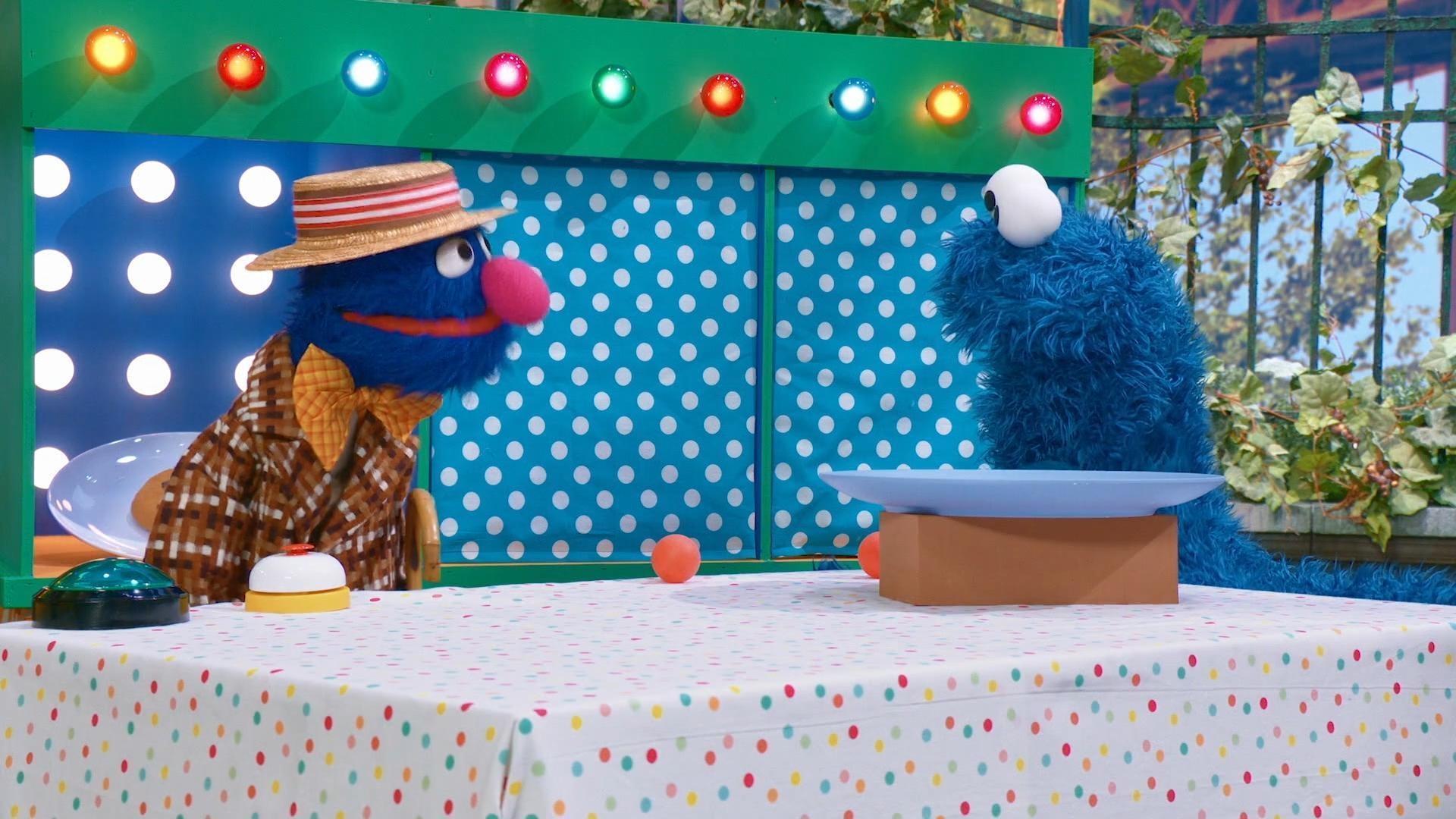 Cookie Monster plays a carnival game with Grover, Elmo, and Abby to win a cookie!