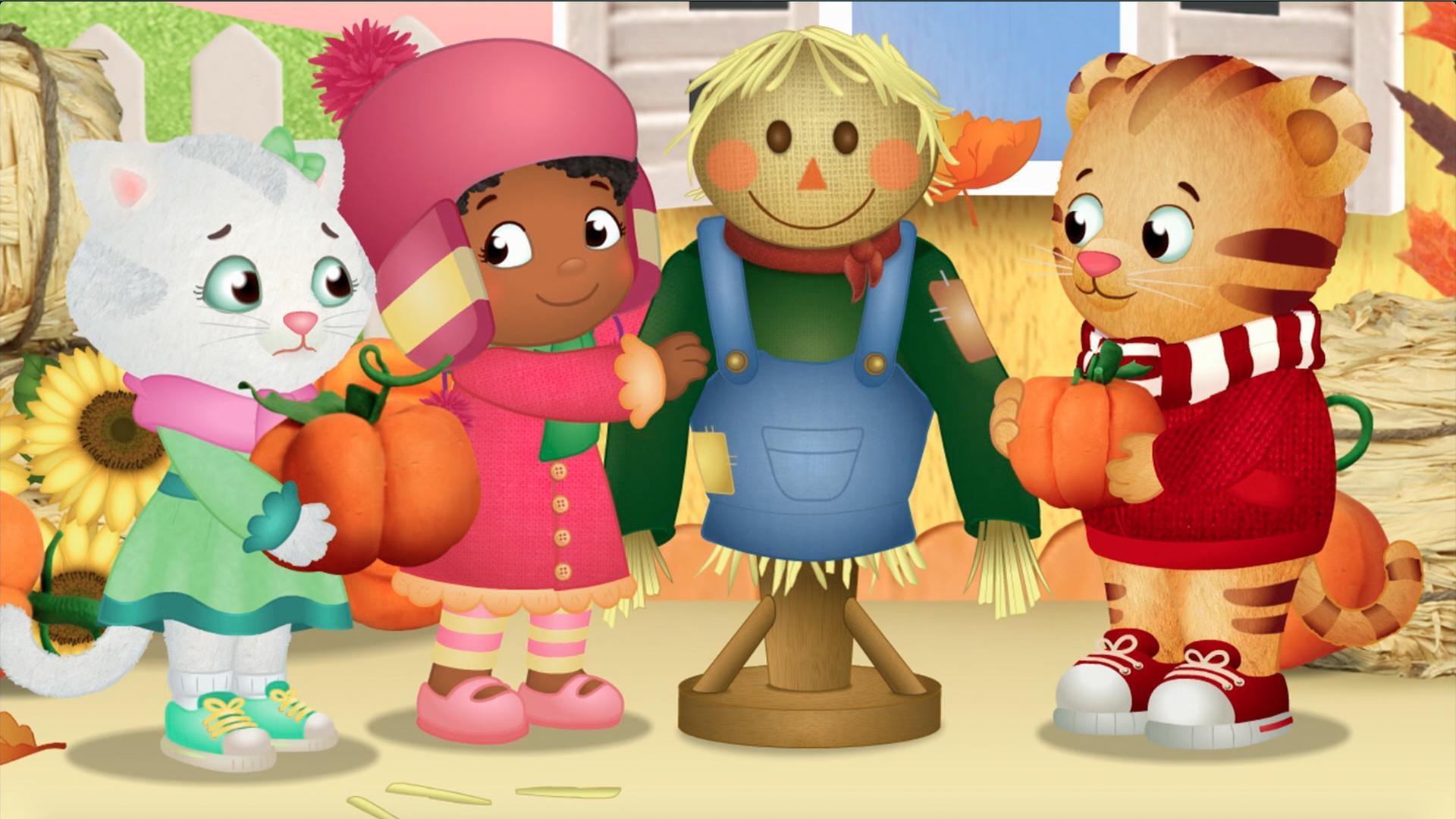 Daniel and Katerina are stacking pumpkins to make a pumpkin tower!