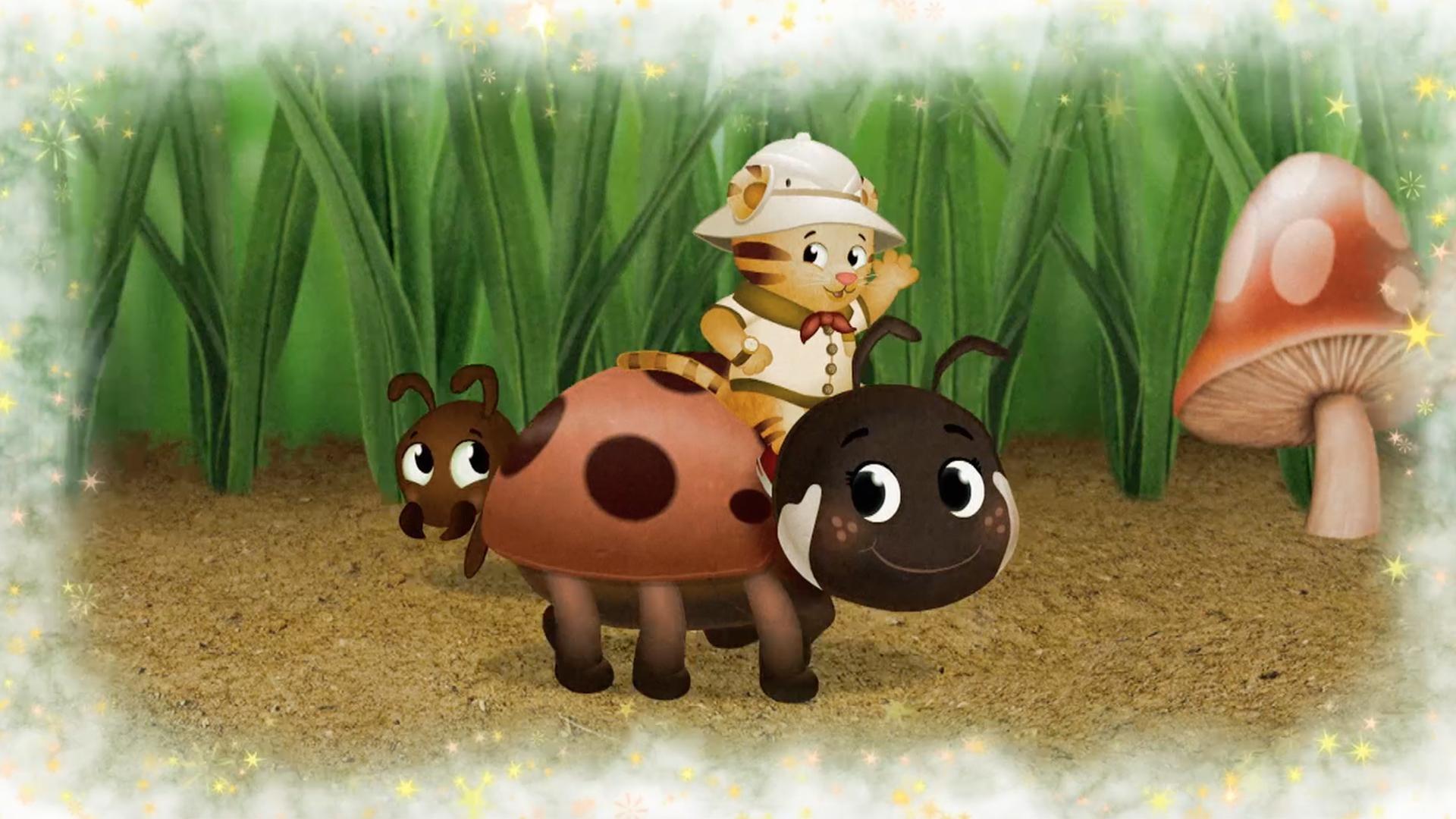 Daniel makes believe he is so little he can ride a ladybug through the grass.