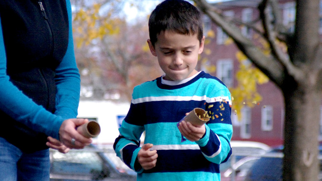 Boy and mom shoot seeds