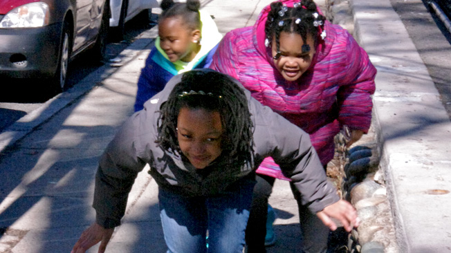 Three girls dodge sun