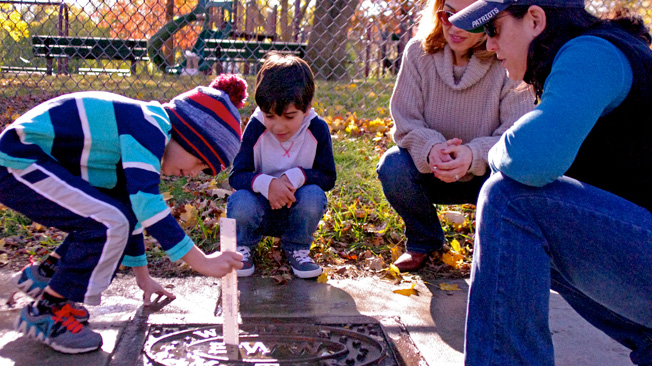 Boy measures puddle